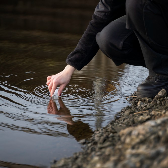 environmental engineer getting water sample